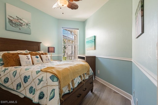 bedroom with ceiling fan and hardwood / wood-style floors