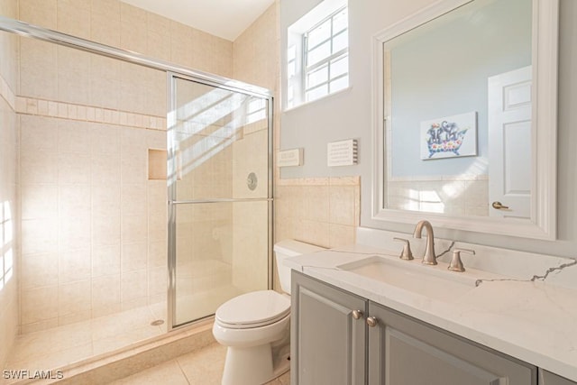 bathroom with toilet, tile walls, tile patterned floors, and walk in shower