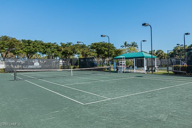 view of tennis court featuring a gazebo