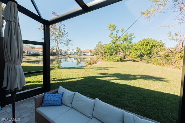 view of yard with a water view and a patio area