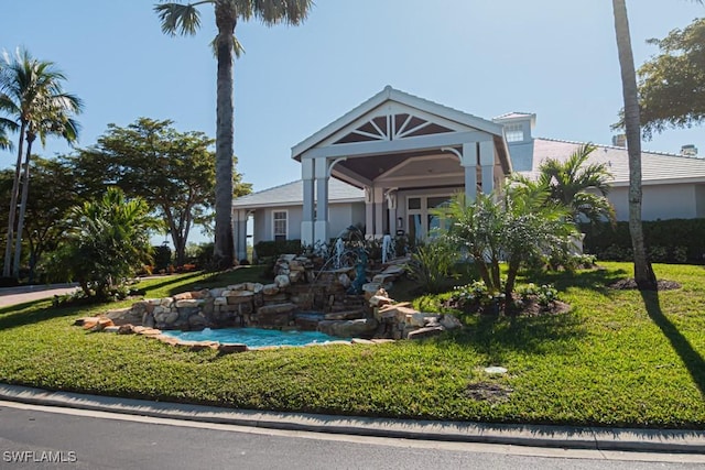 view of front facade with a front lawn