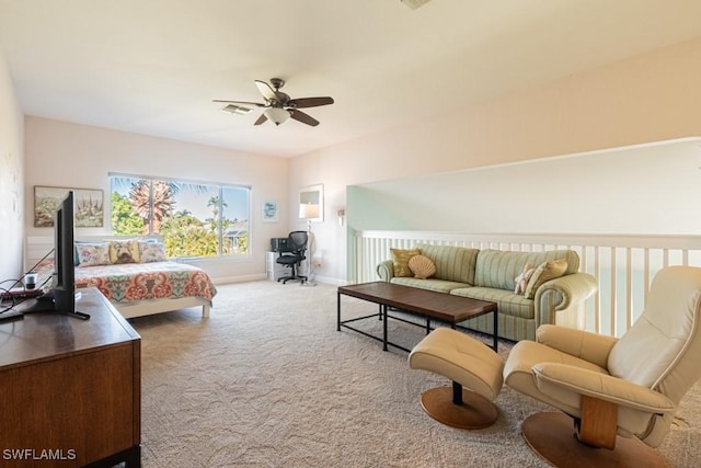 bedroom with ceiling fan and light carpet