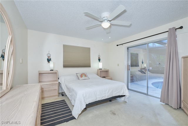 bedroom featuring light carpet, ceiling fan, access to outside, and a textured ceiling