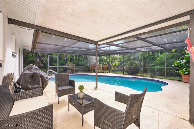 view of pool with a lanai, an outdoor hangout area, grilling area, and a patio area