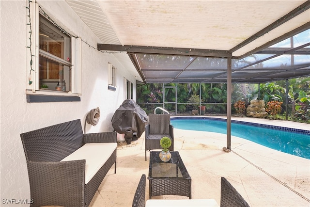 view of swimming pool with a lanai and a patio