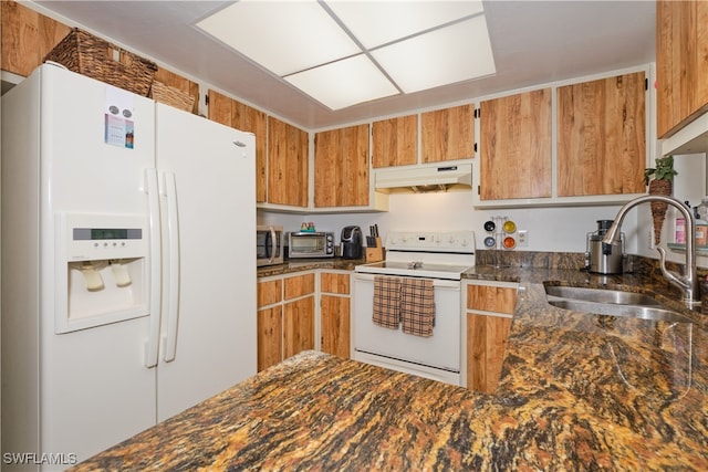 kitchen with sink and white appliances