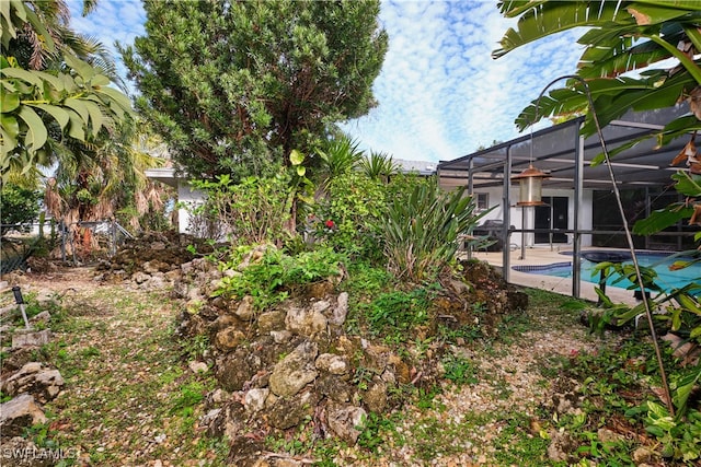 view of yard with a lanai