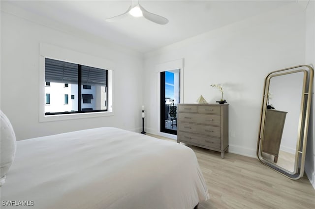 1030 3rd Ave S Unit 419, Naples, FL 34102 - bedroom with light wood-style flooring, ceiling fan, and baseboards