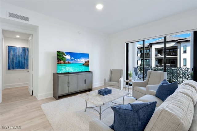 1030 3rd Ave S Unit 419, Naples, FL 34102 - living area with light wood-style floors, baseboards, and recessed lighting
