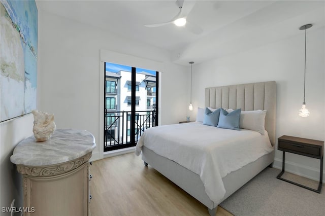 bedroom featuring ceiling fan, access to exterior, and light hardwood / wood-style floors