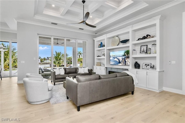 living room with ceiling fan, coffered ceiling, ornamental molding, and light hardwood / wood-style floors