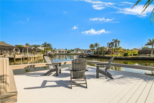 exterior space featuring a water view and a boat dock