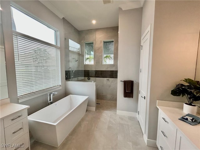 bathroom with vanity and shower with separate bathtub