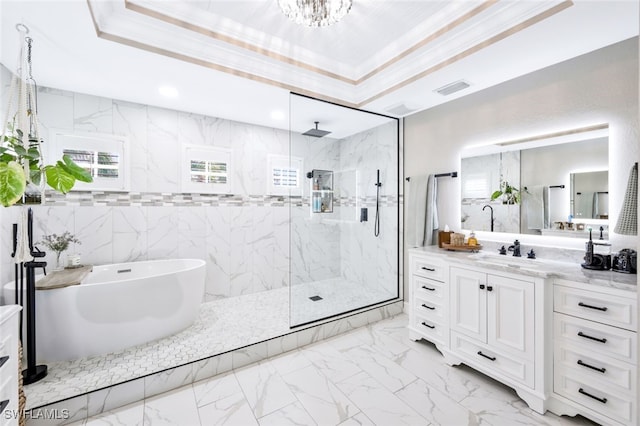 bathroom with vanity, ornamental molding, independent shower and bath, and a tray ceiling