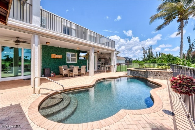 view of swimming pool with a patio, ceiling fan, and an in ground hot tub