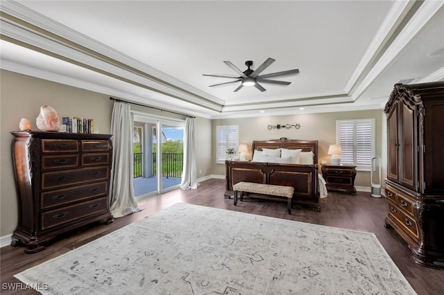 bedroom featuring ceiling fan, a tray ceiling, crown molding, and access to exterior