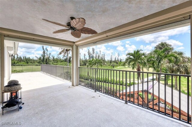 view of patio / terrace featuring ceiling fan and a balcony