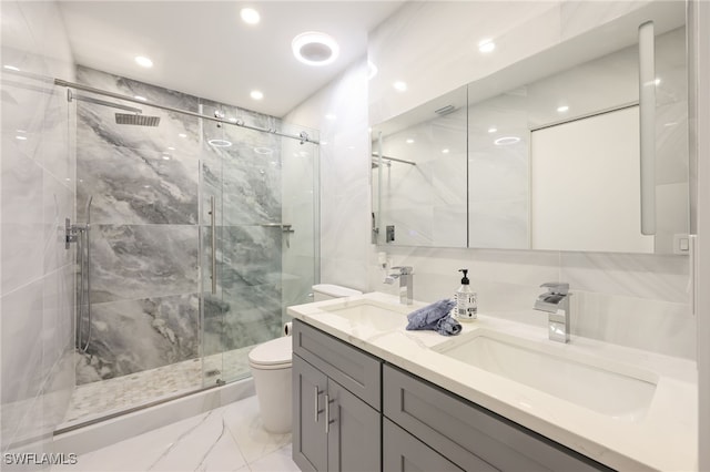 bathroom featuring an enclosed shower, vanity, and toilet