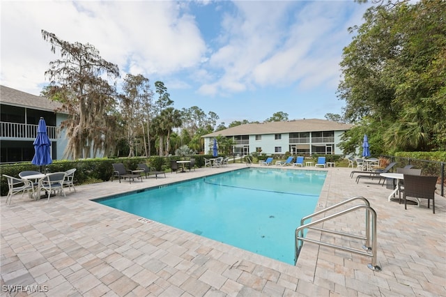 view of swimming pool featuring a patio area