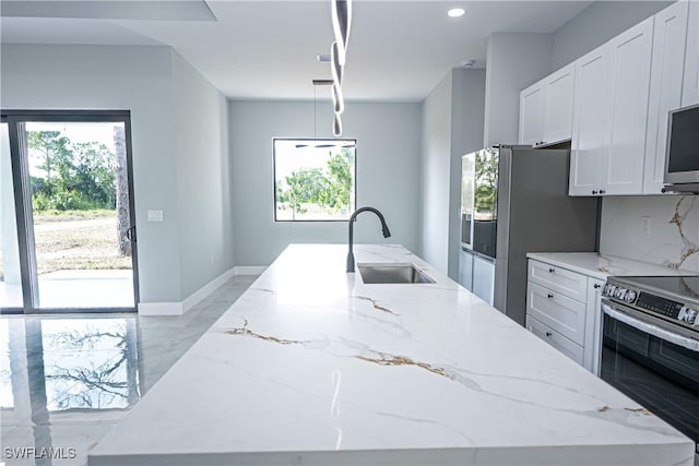 1254 Ellipse St E, Lehigh Acres, FL 33974 - kitchen with a sink, light stone countertops, stainless steel appliances, and marble finish floor