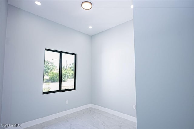 1254 Ellipse St E, Lehigh Acres, FL 33974 - empty room featuring baseboards, recessed lighting, and marble finish floor