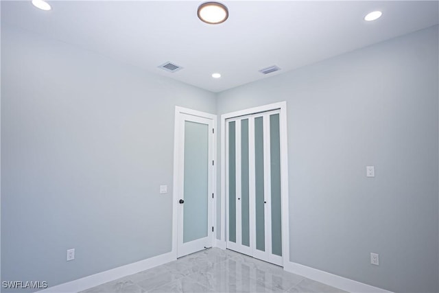 1254 Ellipse St E, Lehigh Acres, FL 33974 - spare room with recessed lighting, baseboards, marble finish floor, and visible vents