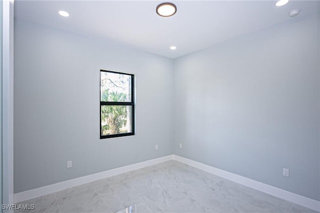 1254 Ellipse St E, Lehigh Acres, FL 33974 - spare room featuring recessed lighting, baseboards, and marble finish floor