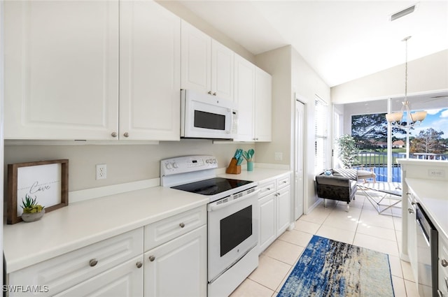 kitchen with white cabinetry, pendant lighting, white appliances, and light tile patterned floors