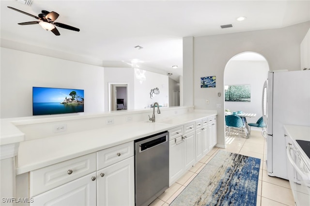 kitchen featuring white cabinetry, stove, stainless steel dishwasher, and light tile patterned flooring