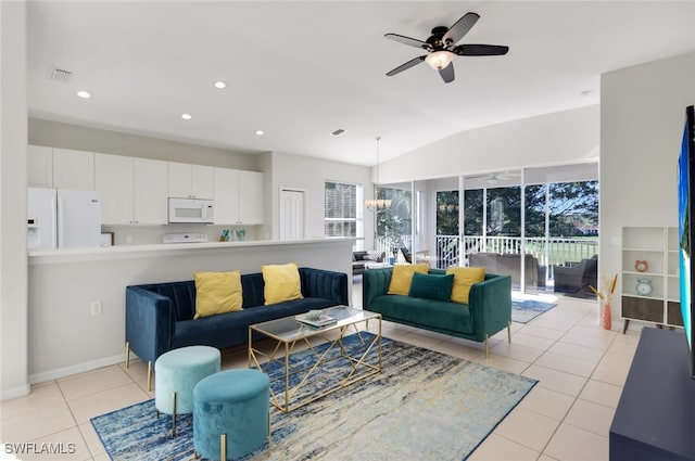 living room featuring vaulted ceiling, ceiling fan, and light tile patterned flooring