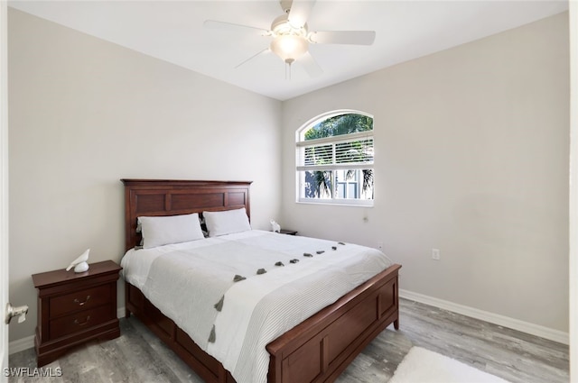 bedroom with ceiling fan and light hardwood / wood-style flooring