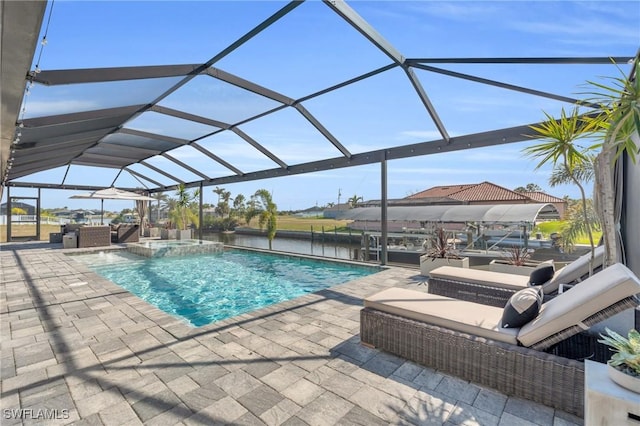 view of swimming pool with a lanai and a patio