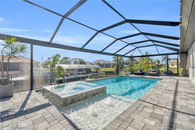 view of swimming pool featuring an in ground hot tub, glass enclosure, and a patio