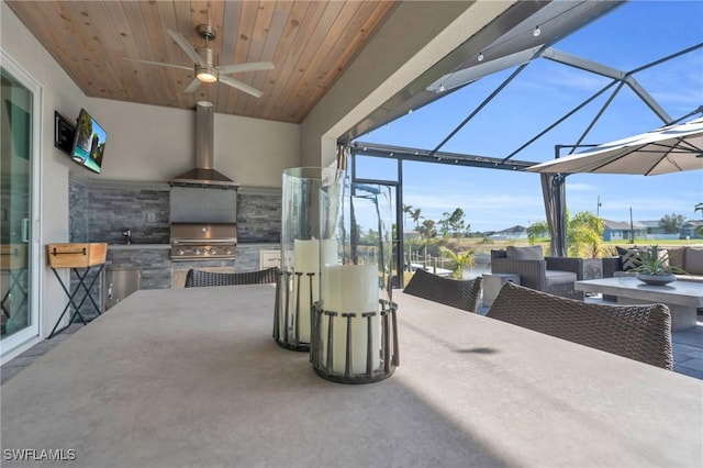 view of patio / terrace with ceiling fan, area for grilling, and outdoor lounge area