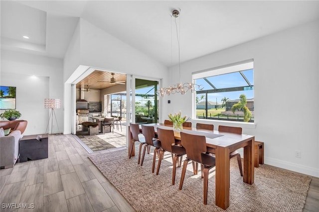 dining area with a towering ceiling