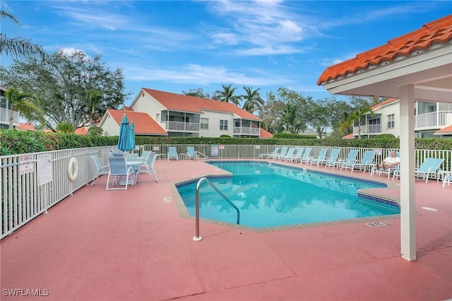 view of swimming pool with a patio