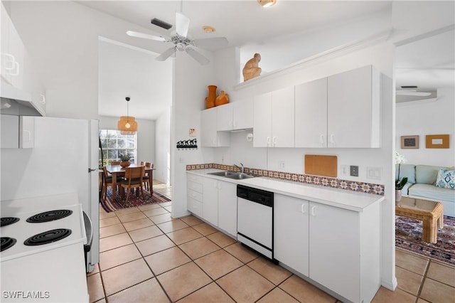 kitchen with sink, white cabinets, white appliances, light tile patterned flooring, and hanging light fixtures