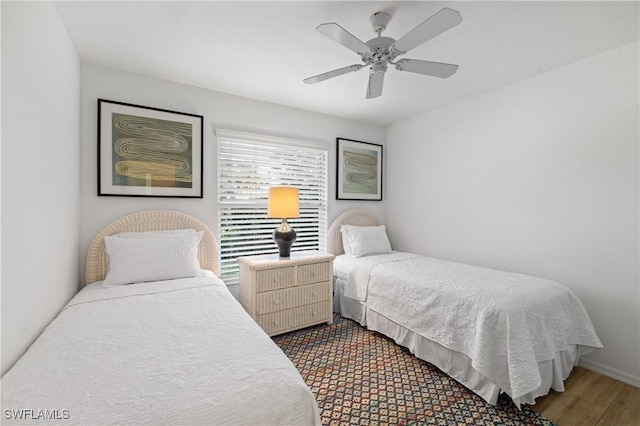 bedroom with ceiling fan and hardwood / wood-style floors