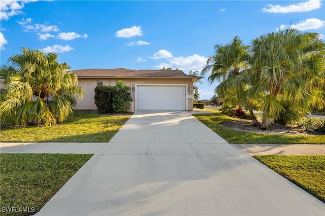 view of front of house featuring a front yard and a garage