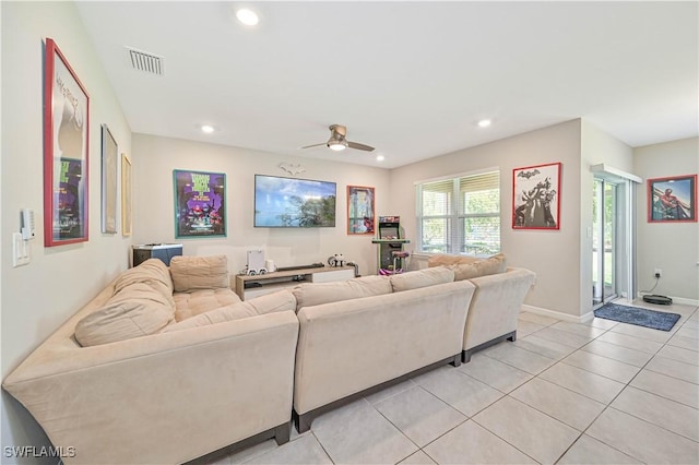 tiled living room with ceiling fan