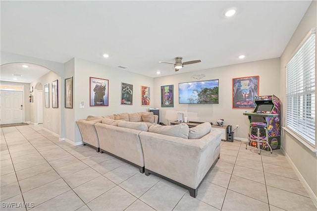 living room featuring ceiling fan and light tile patterned floors