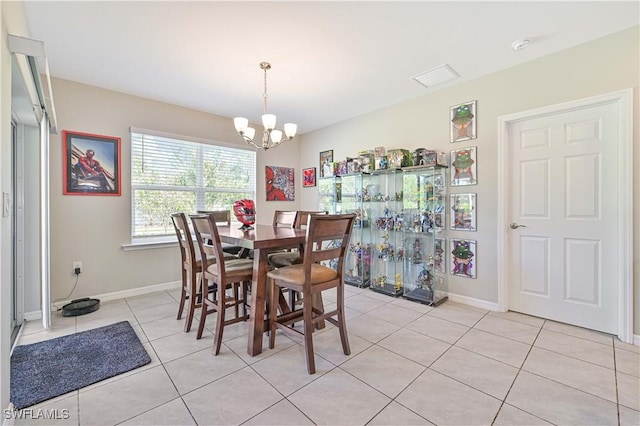 tiled dining area featuring a notable chandelier