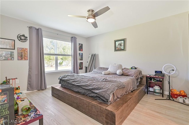 bedroom featuring ceiling fan and light wood-type flooring