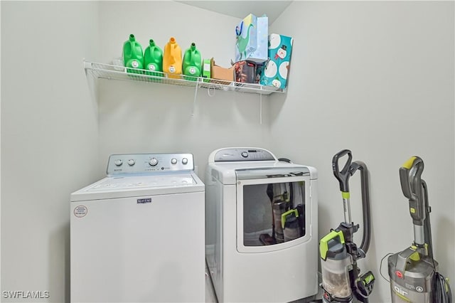 laundry area featuring washing machine and clothes dryer