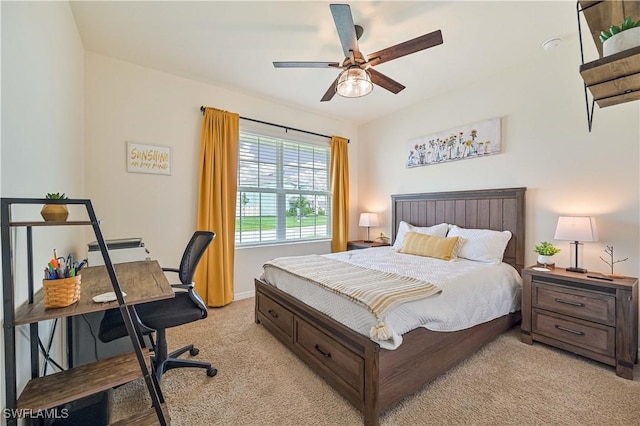 bedroom featuring ceiling fan and light colored carpet