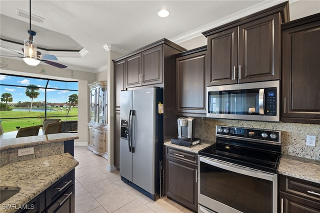 kitchen with stainless steel appliances, tasteful backsplash, and crown molding