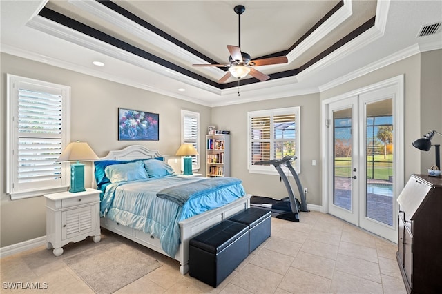 bedroom featuring a raised ceiling, crown molding, ceiling fan, french doors, and access to outside