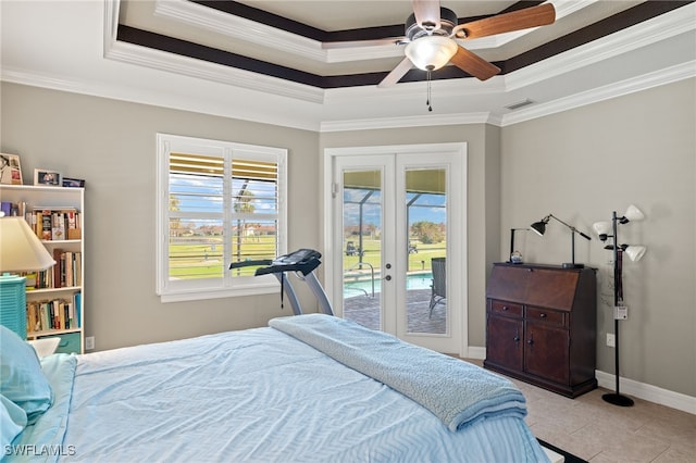 bedroom featuring ceiling fan, french doors, access to outside, and a tray ceiling