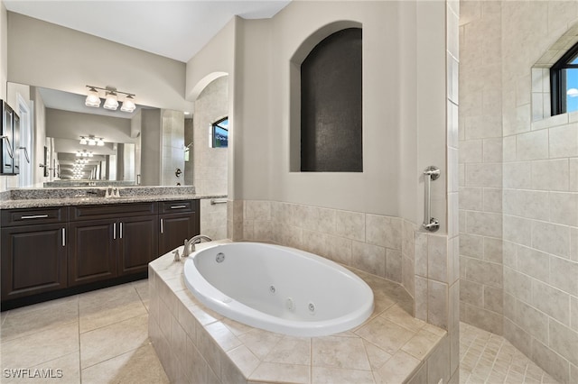 bathroom featuring vanity, tile patterned floors, and separate shower and tub