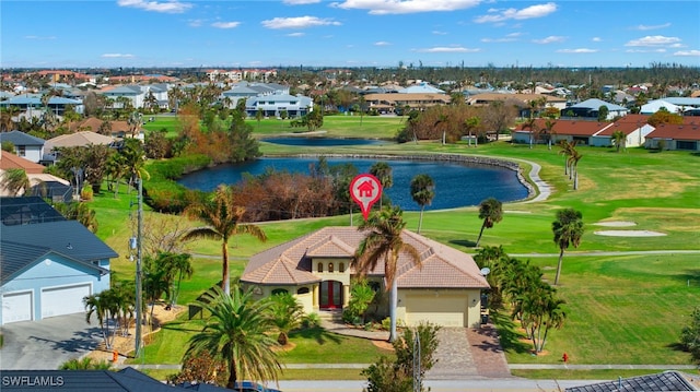 birds eye view of property with a water view